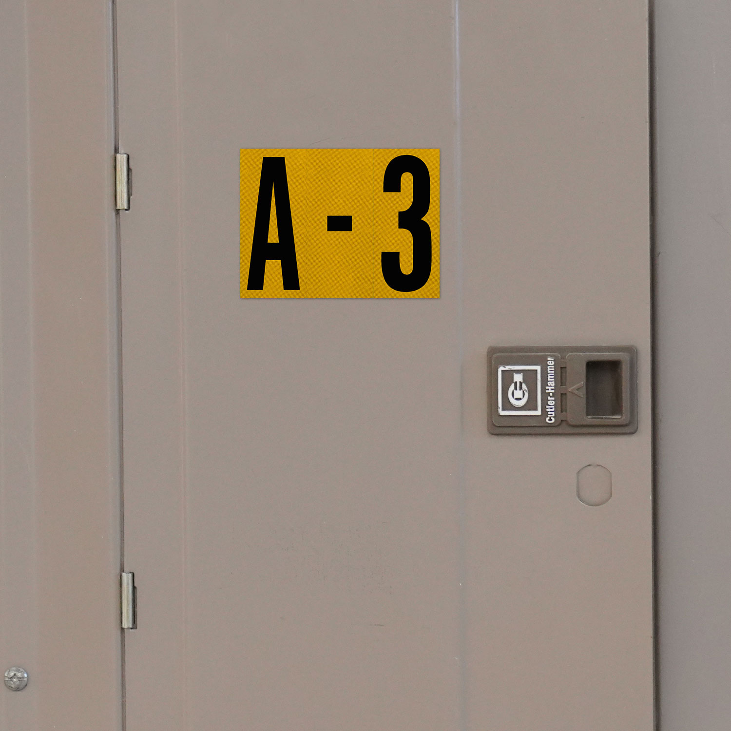 1" Black Character on Yellow EG Reflective Vinyl Label