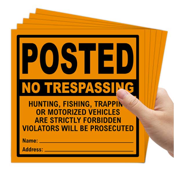 Orange Posted No Trespassing Strictly Forbidden Sign
