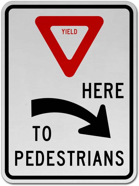 Yield Here to Pedestrians Sign