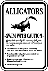 Alligators Swim With Caution Sign